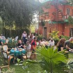 Guests relaxing in the garden at New Pokhara Lodge