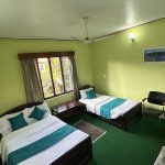 “Standard room with comfortable bed at New Pokhara Lodge, Lakeside Pokhara”